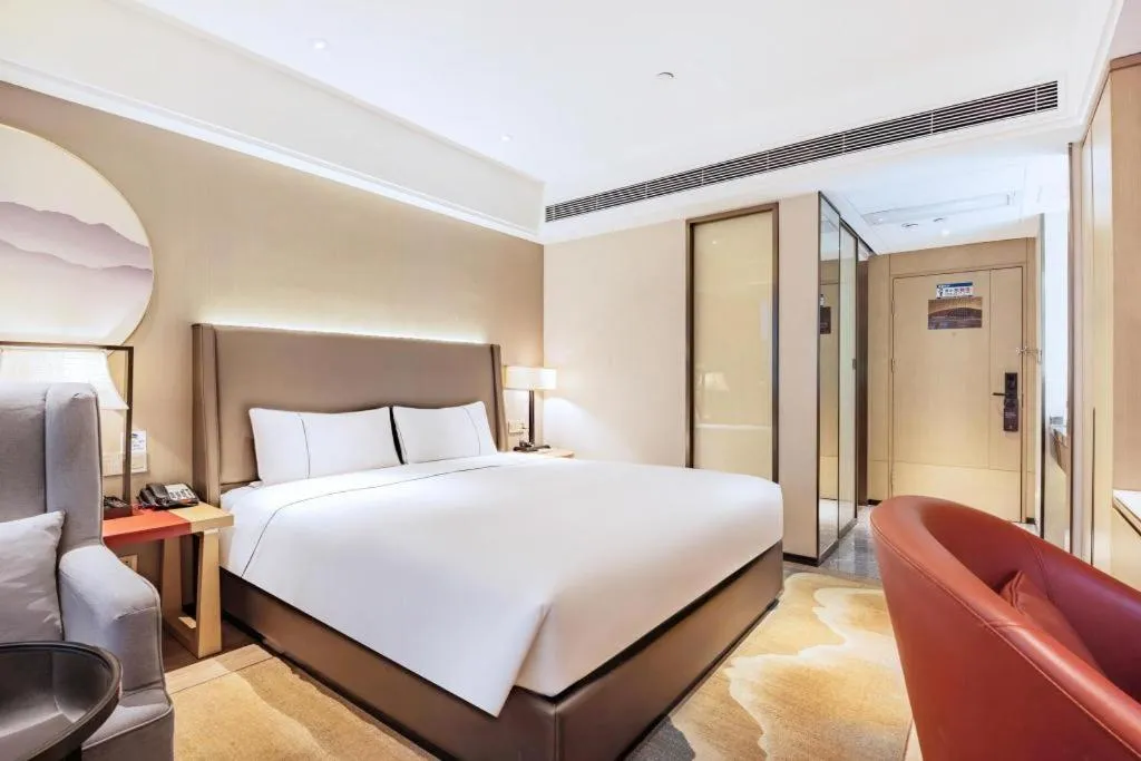 Bed in Echeng Hotel Changsha Evening News