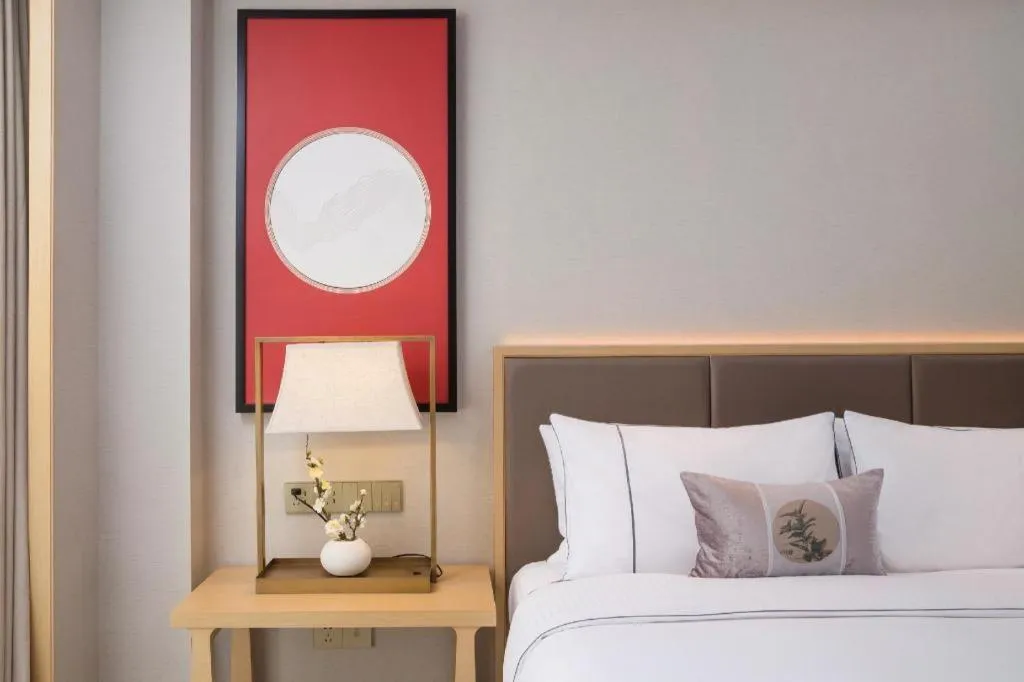 Bed in Echeng Hotel Changsha Evening News