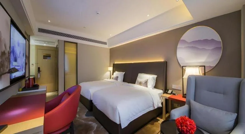 Bed in Echeng Hotel Changsha Evening News