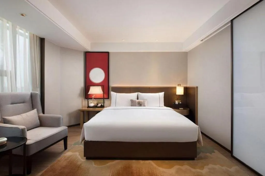 Bed in Echeng Hotel Changsha Evening News