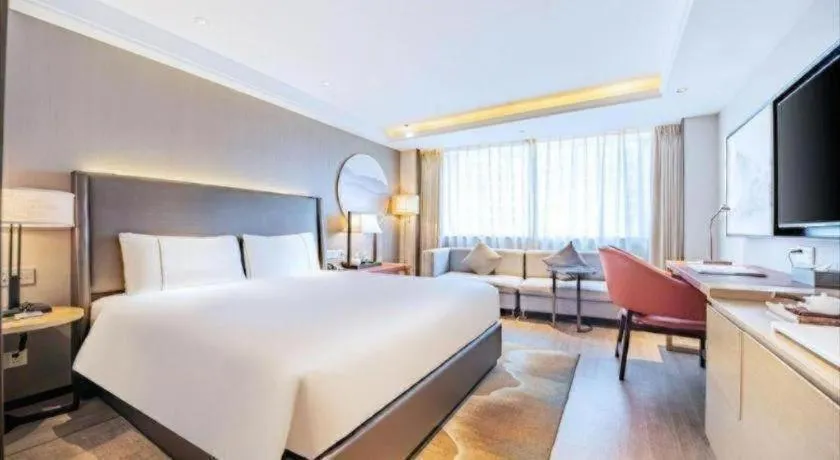 Bed in Echeng Hotel Changsha Evening News