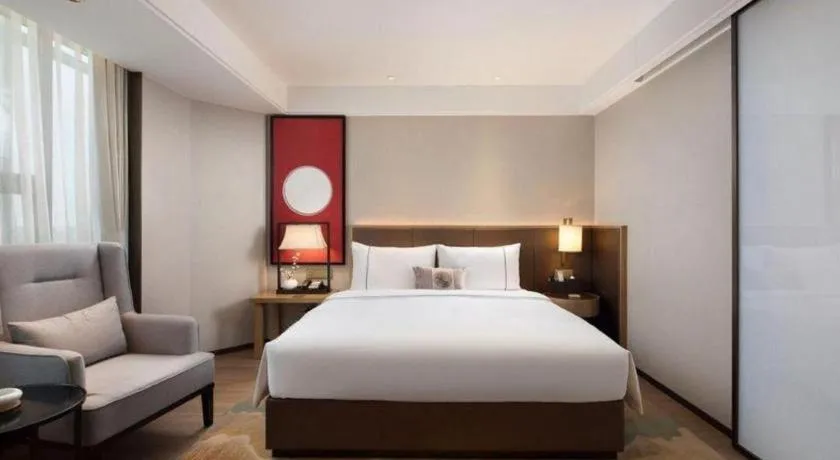 Bed in Echeng Hotel Changsha Evening News