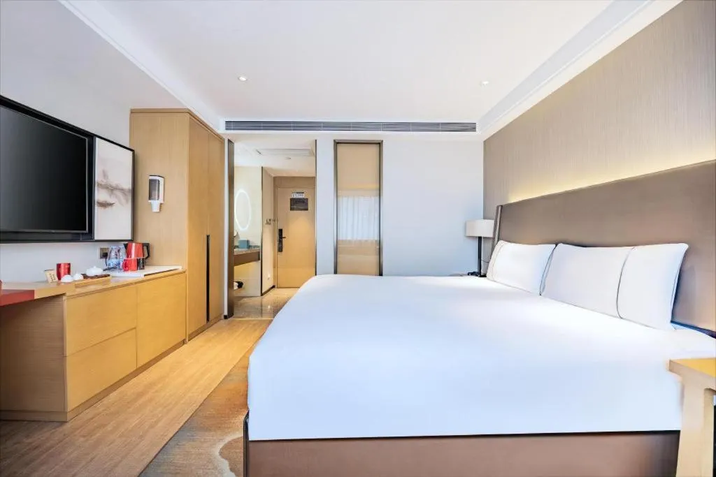 Bed in Echeng Hotel Changsha Evening News