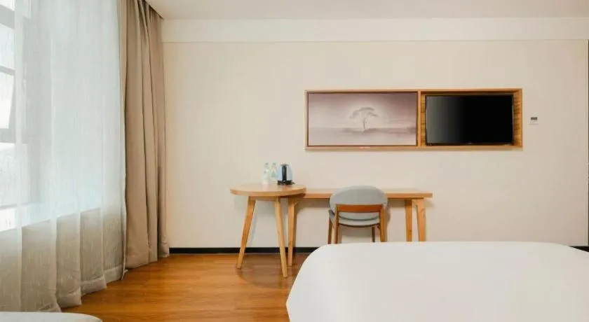 Bed in JTOUR Inn Hechi Yizhou Municipal Central Plaza