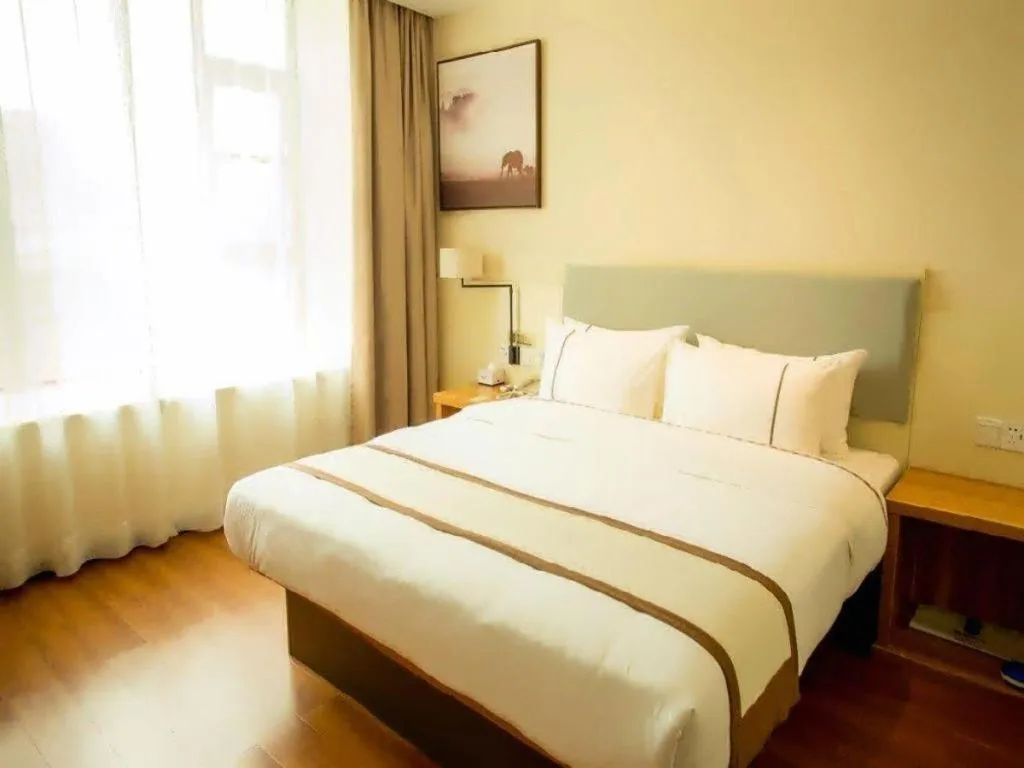 Bed in JTOUR Inn Hechi Yizhou Municipal Central Plaza