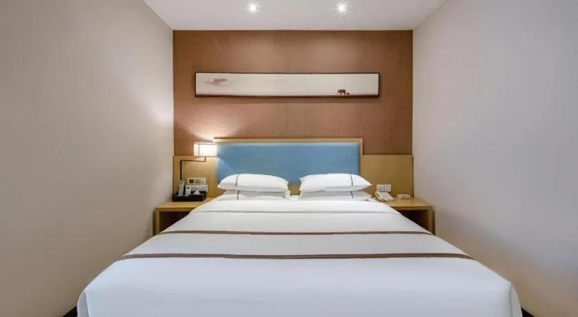 Bed in JTOUR Inn Hechi Yizhou Municipal Central Plaza