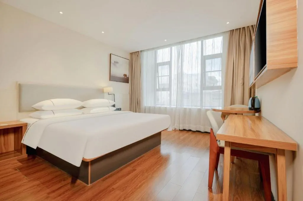 Bed in JTOUR Inn Hechi Yizhou Municipal Central Plaza