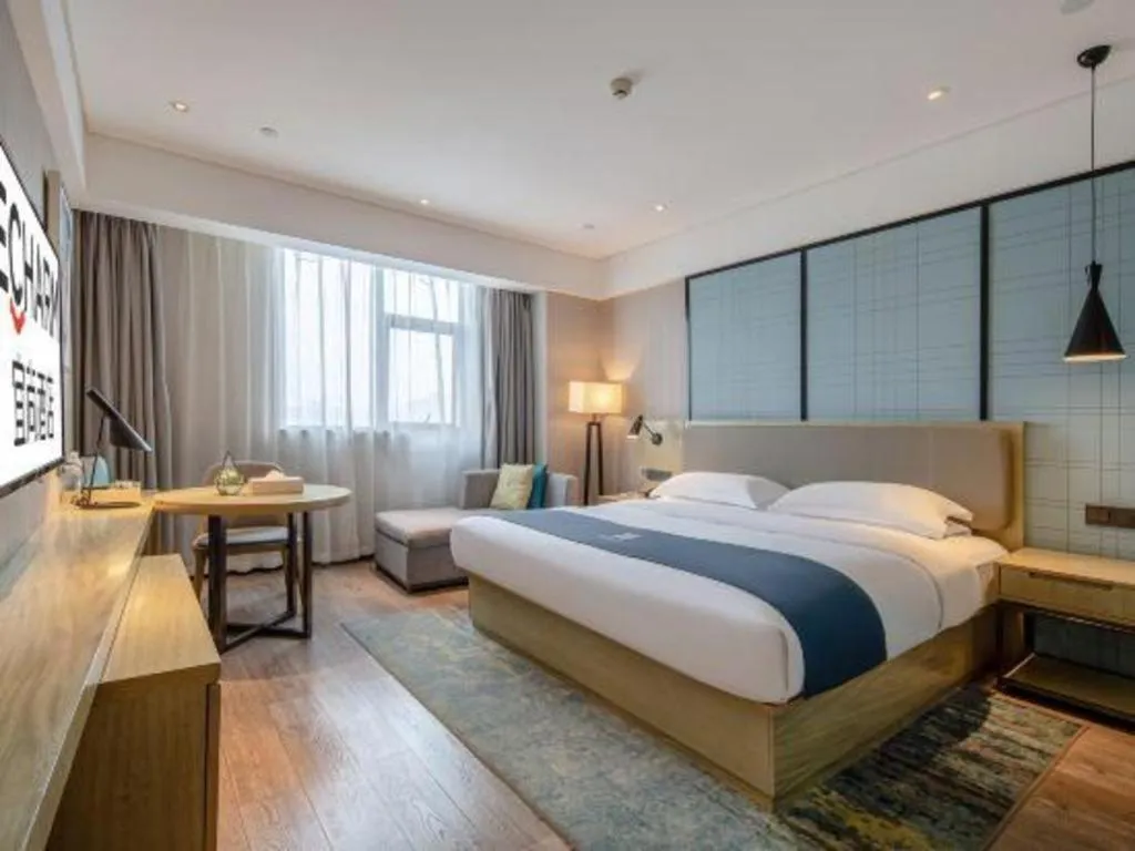 Bed in Echarm Hotel Nanning Chaoyang Square River View