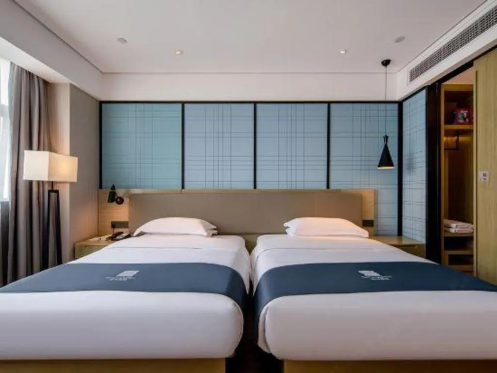 Bed in Echarm Hotel Nanning Chaoyang Square River View