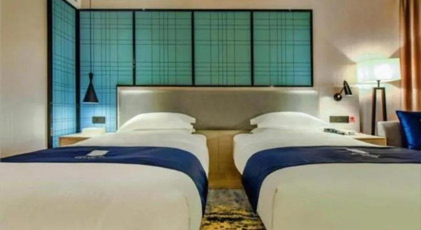Bed in Echarm Hotel Anshun High-speed Railway Station Jichang Road