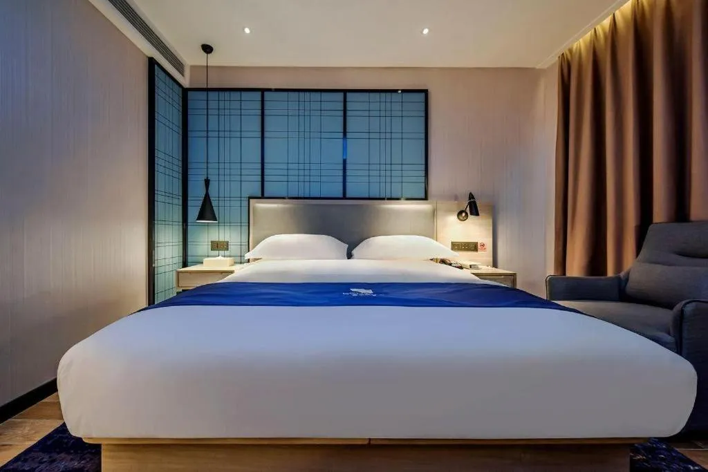 Bed in Echarm Hotel Anshun High-speed Railway Station Jichang Road