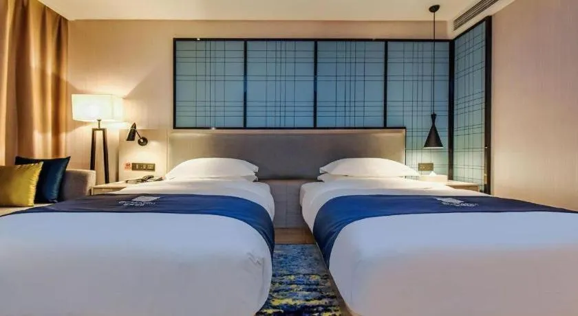 Bed in Echarm Hotel Anshun High-speed Railway Station Jichang Road