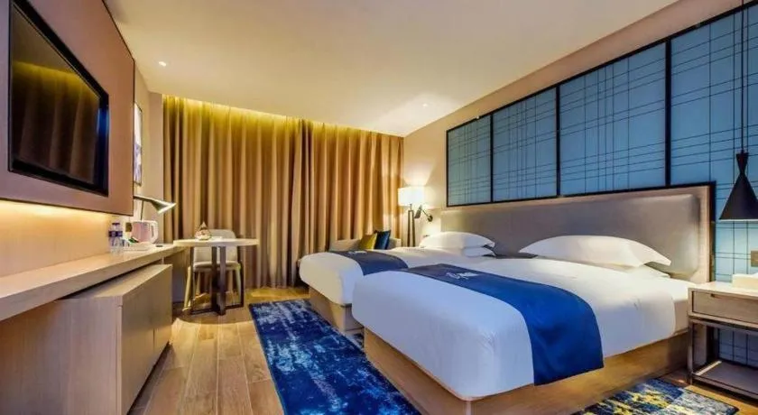 Bed in Echarm Hotel Anshun High-speed Railway Station Jichang Road
