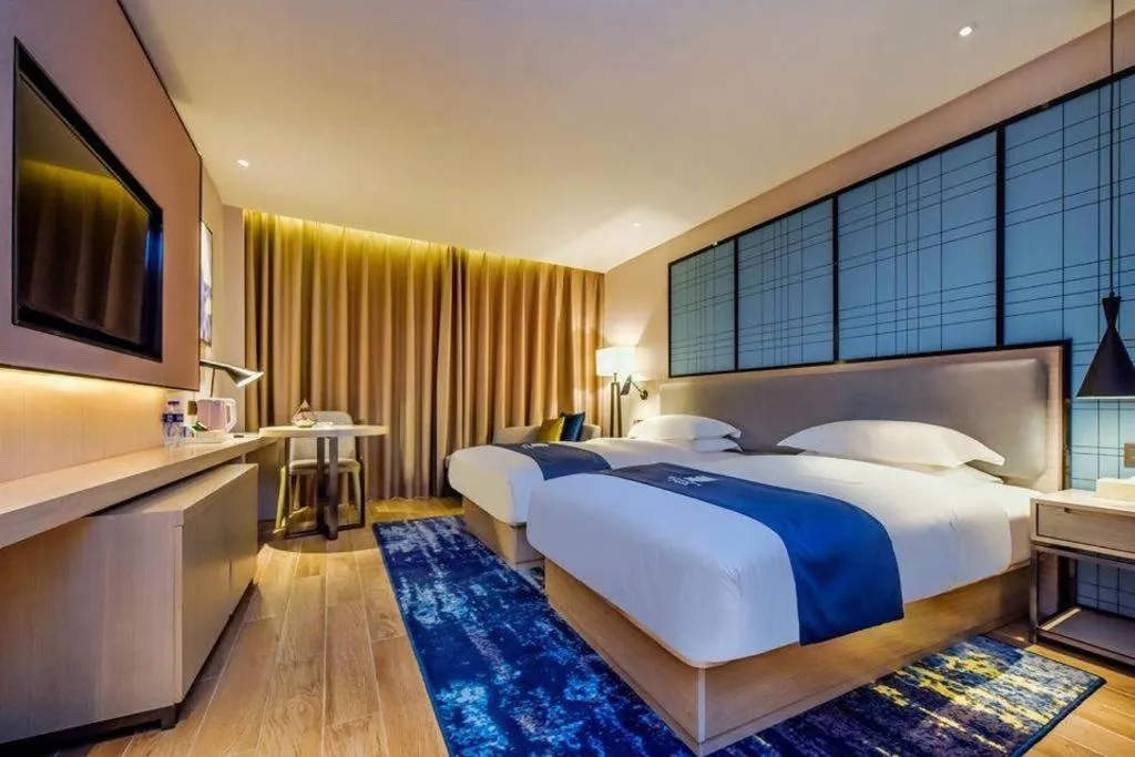 Bed in Echarm Hotel Anshun High-speed Railway Station Jichang Road