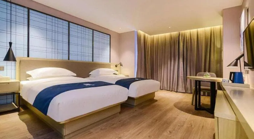 Bed in Echarm Hotel Anshun High-speed Railway Station Jichang Road