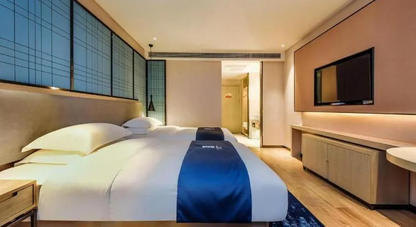 Bed in Echarm Hotel Anshun High-speed Railway Station Jichang Road