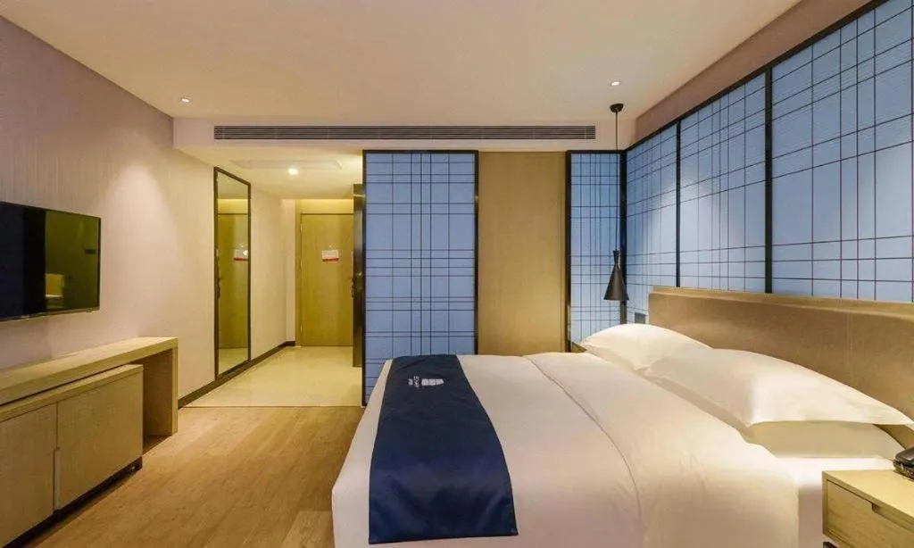 Bed in Echarm Hotel Anshun High-speed Railway Station Jichang Road