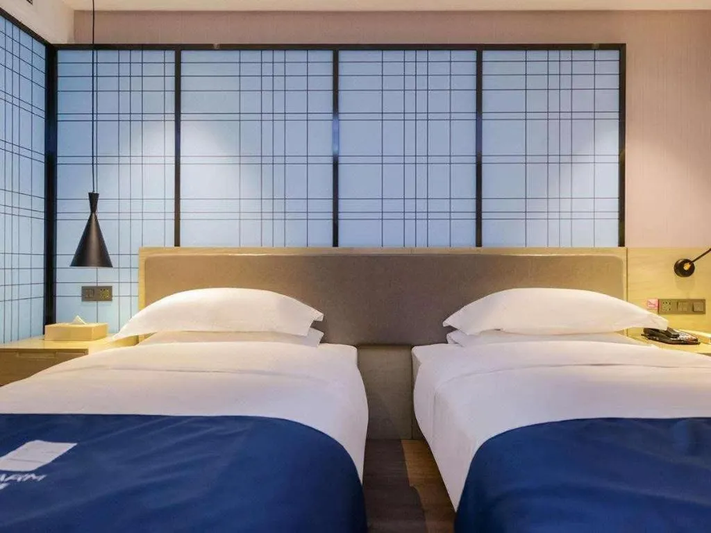 Bed in Echarm Hotel Anshun High-speed Railway Station Jichang Road