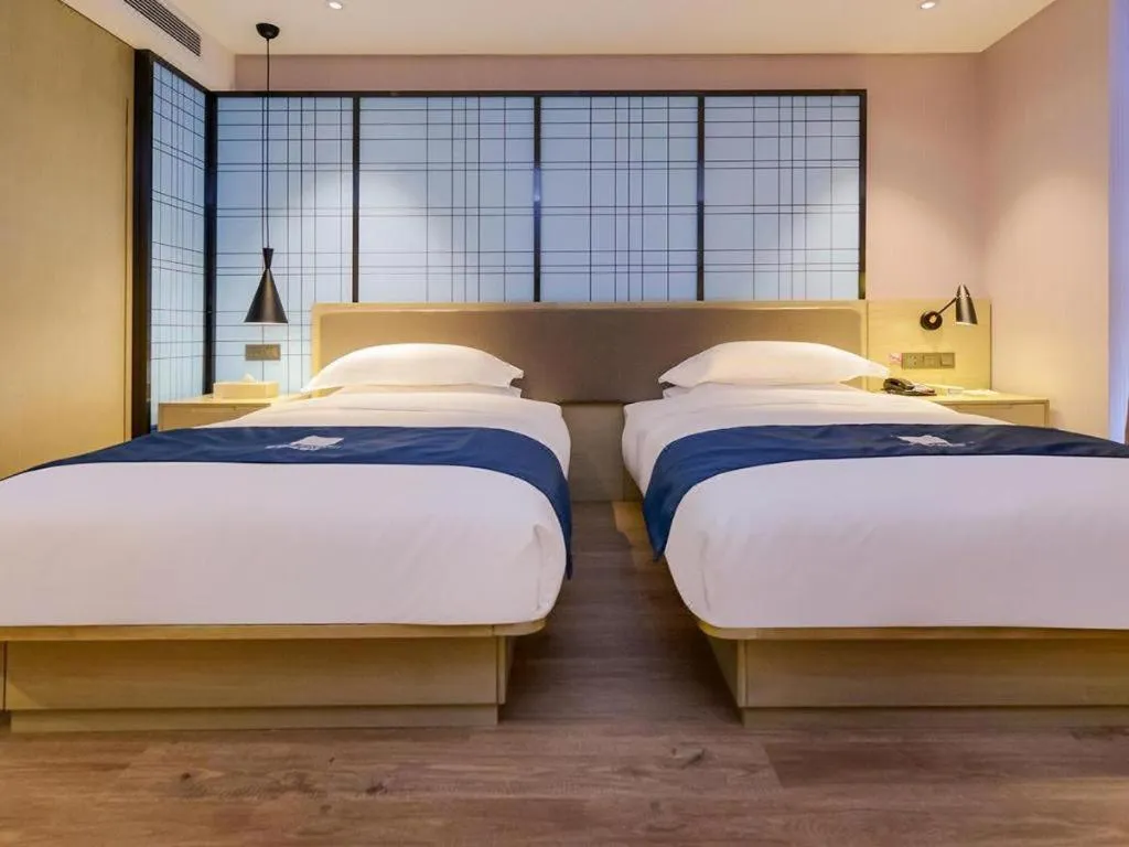 Bed in Echarm Hotel Anshun High-speed Railway Station Jichang Road