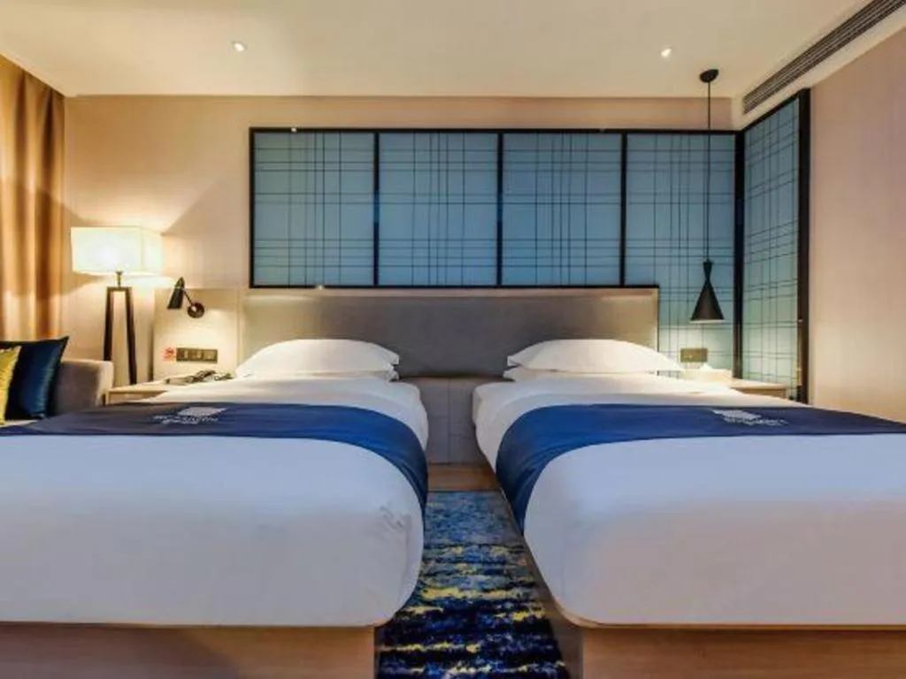 Bed in Echarm Hotel Anshun High-speed Railway Station Jichang Road