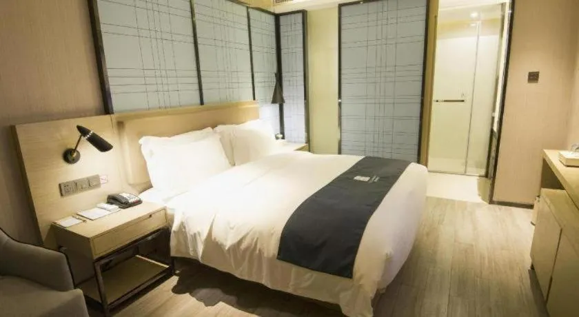 Bed in Echarm Hotel Nanning Guangxi University Xinyang Longteng District Maternal and Child Hospital