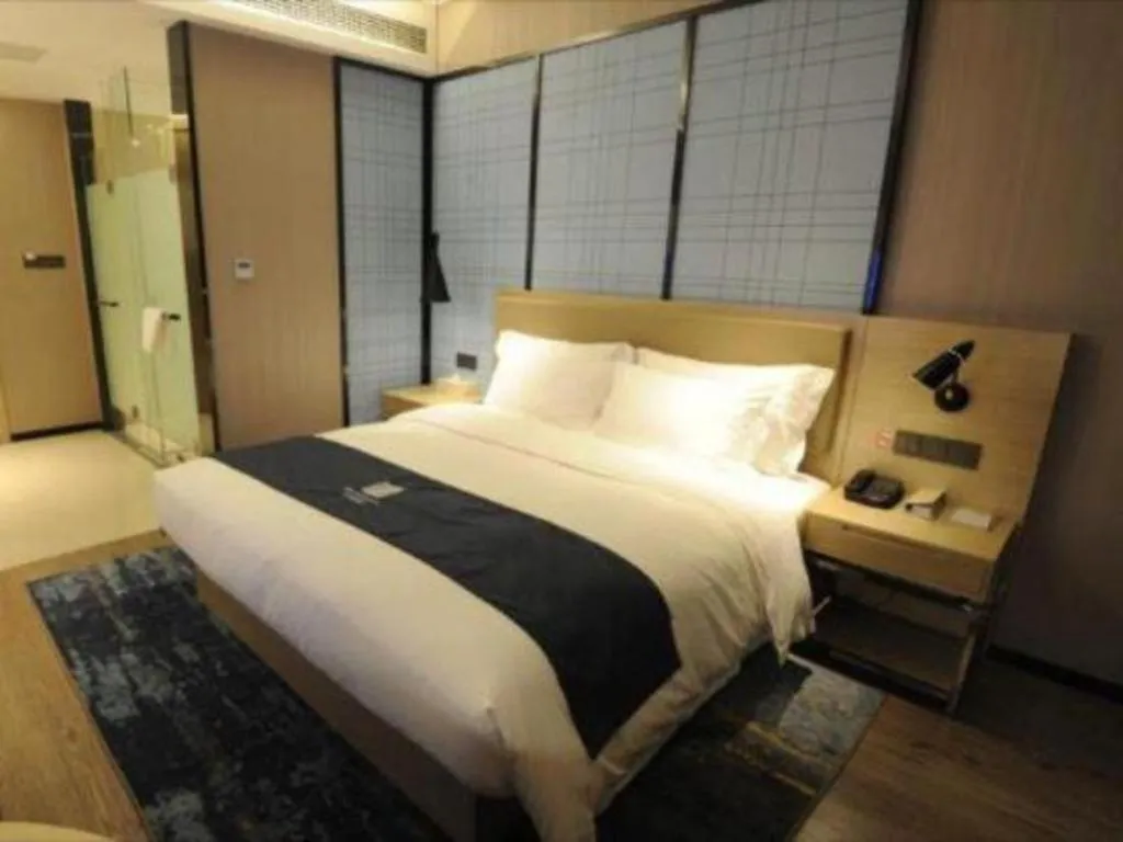 Bed in Echarm Hotel Nanning Guangxi University Xinyang Longteng District Maternal and Child Hospital