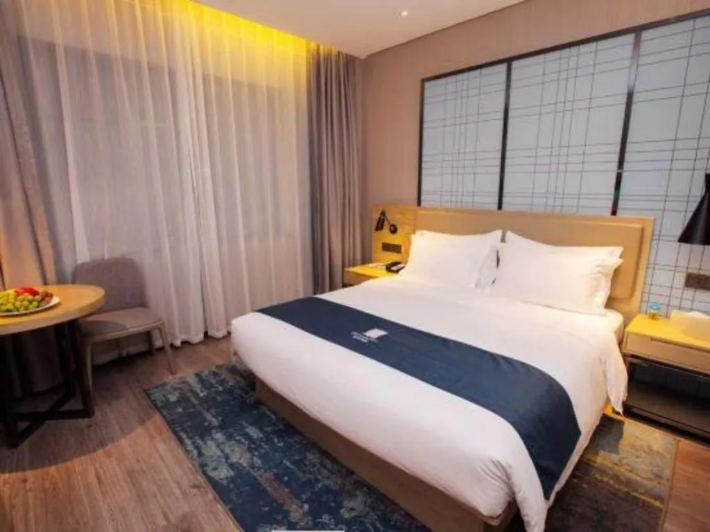 Bed in Echarm Hotel Nanning Guangxi University Xinyang Longteng District Maternal and Child Hospital