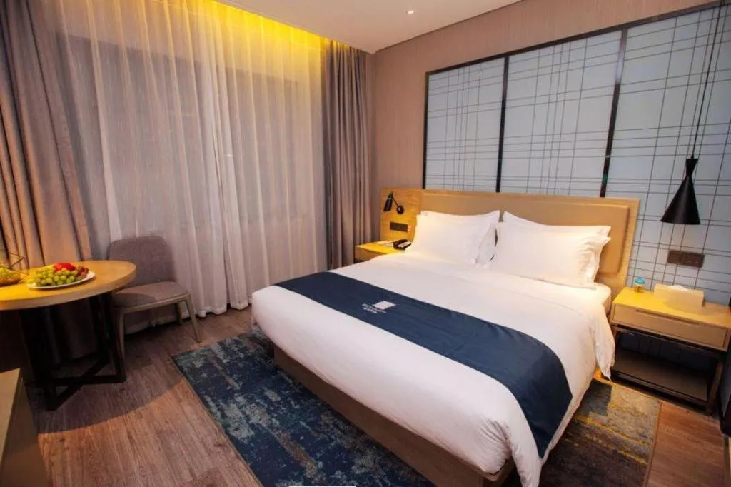 Bed in Echarm Hotel Nanning Guangxi University Xinyang Longteng District Maternal and Child Hospital