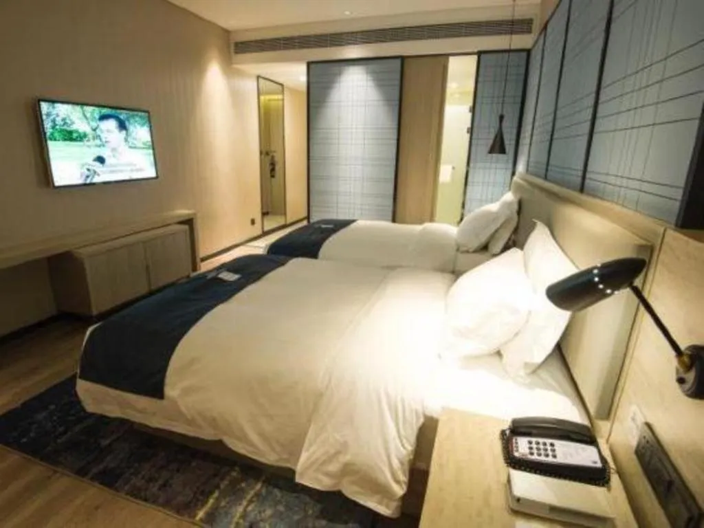 Bed in Echarm Hotel Nanning Guangxi University Xinyang Longteng District Maternal and Child Hospital