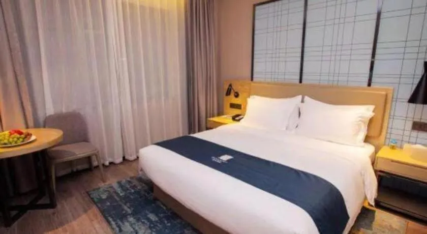 Bed in Echarm Hotel Nanning Guangxi University Xinyang Longteng District Maternal and Child Hospital