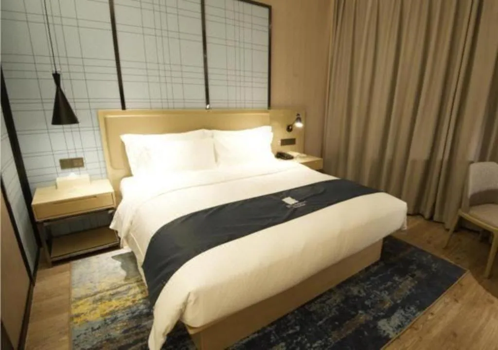 Bed in Echarm Hotel Nanning Guangxi University Xinyang Longteng District Maternal and Child Hospital