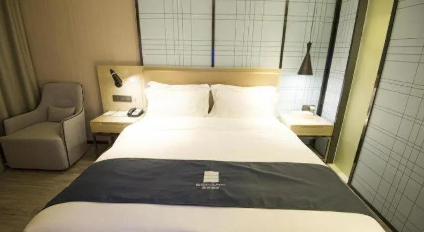 Bed in Echarm Hotel Nanning Guangxi University Xinyang Longteng District Maternal and Child Hospital