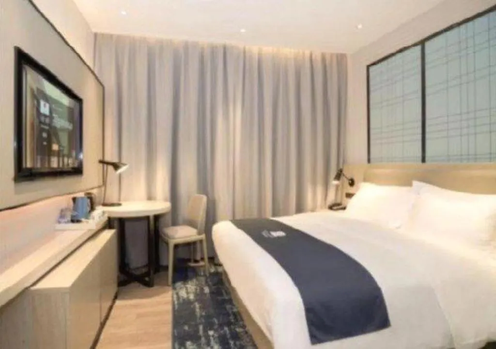 Bed in Echarm Hotel Nanning Guangxi University Xinyang Longteng District Maternal and Child Hospital