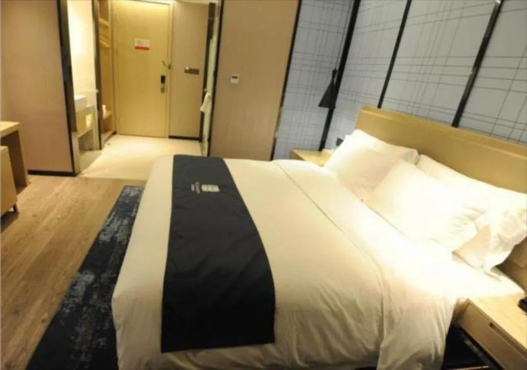 Bed in Echarm Hotel Nanning Guangxi University Xinyang Longteng District Maternal and Child Hospital