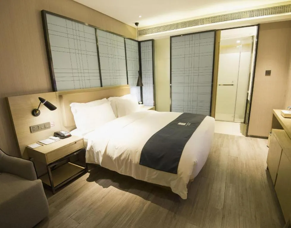 Bed in Echarm Hotel Nanning Guangxi University Xinyang Longteng District Maternal and Child Hospital