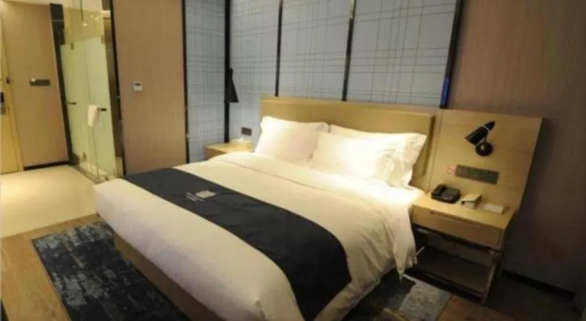 Bed in Echarm Hotel Nanning Guangxi University Xinyang Longteng District Maternal and Child Hospital