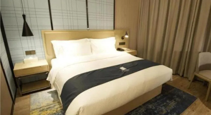 Bed in Echarm Hotel Nanning Guangxi University Xinyang Longteng District Maternal and Child Hospital