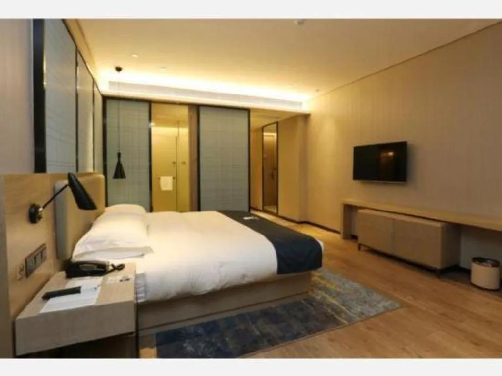 Bed in Echarm Hotel Liuzhou Liunan Wanda Plaza