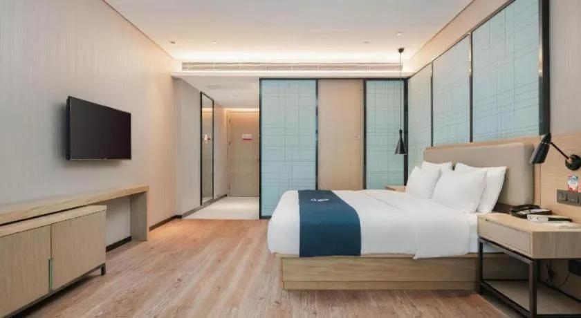 Bed in Echarm Hotel Liuzhou Liunan Wanda Plaza