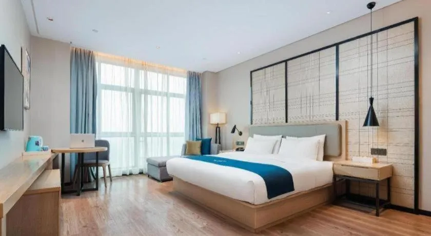 Bed in Echarm Hotel Liuzhou Liunan Wanda Plaza