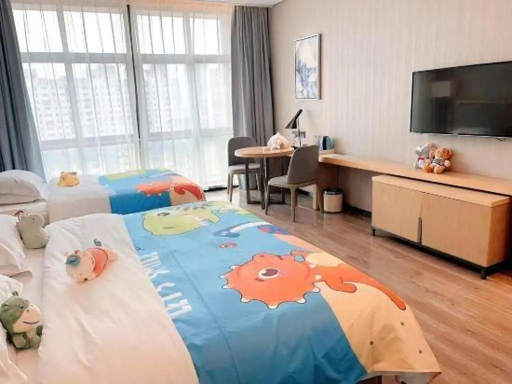 Bed in Echarm Hotel Liuzhou Liunan Wanda Plaza