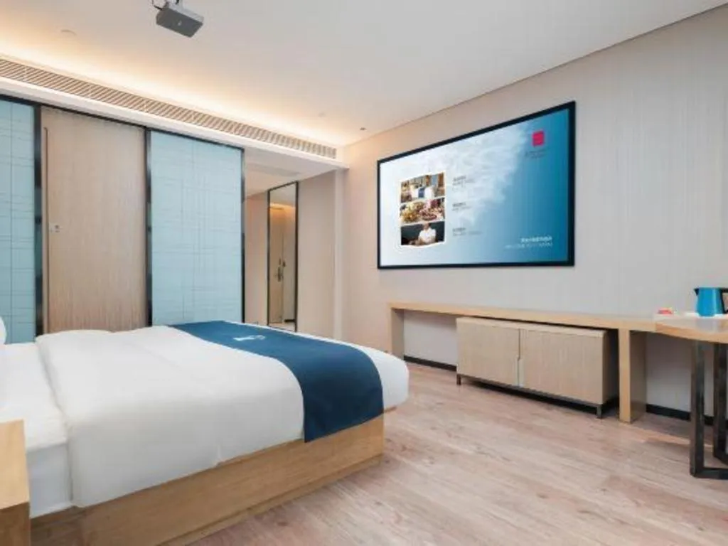 Bed in Echarm Hotel Liuzhou Liunan Wanda Plaza