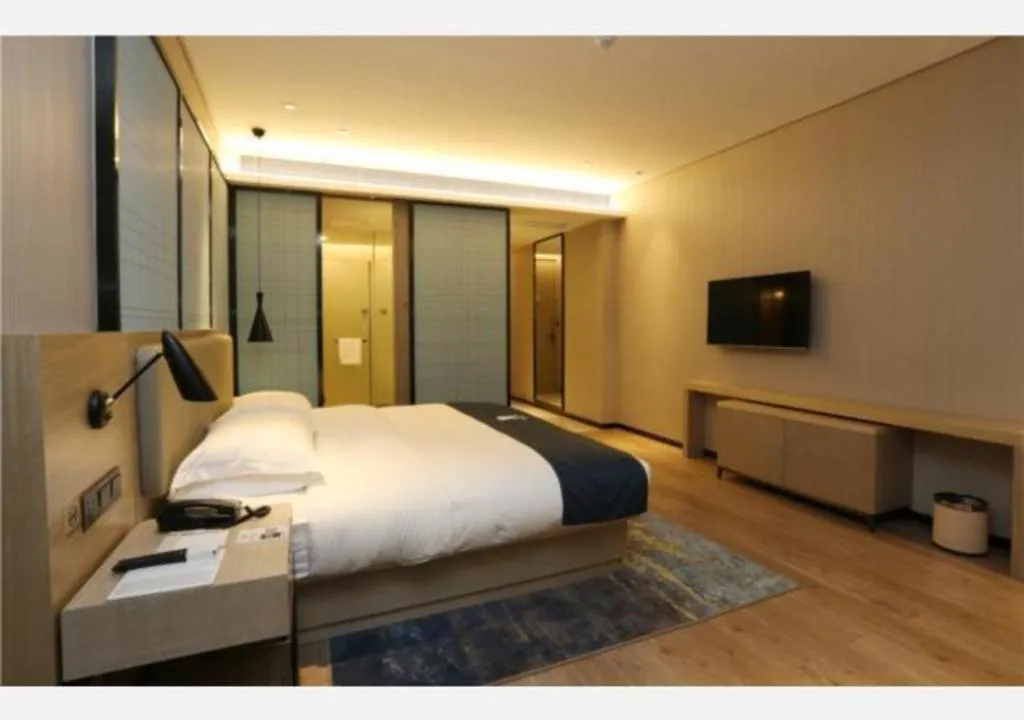 Bed in Echarm Hotel Liuzhou Liunan Wanda Plaza