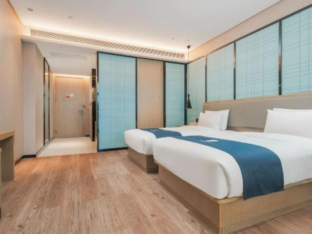 Bed in Echarm Hotel Liuzhou Liunan Wanda Plaza