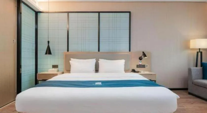 Bed in Echarm Hotel Liuzhou Liunan Wanda Plaza