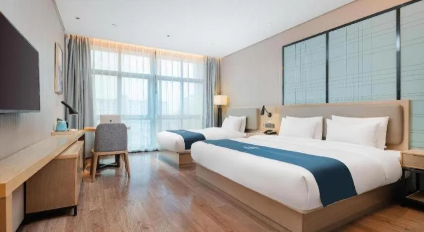Bed in Echarm Hotel Liuzhou Liunan Wanda Plaza