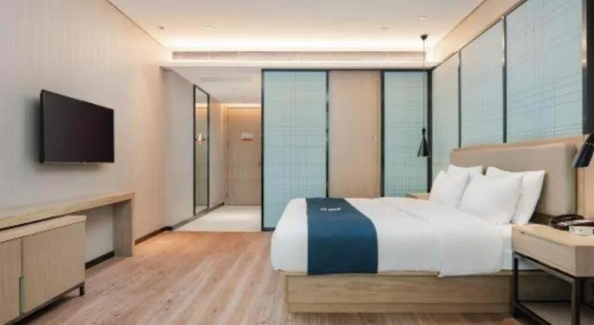 Bed in Echarm Hotel Liuzhou Liunan Wanda Plaza