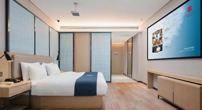 Bed in Echarm Hotel Liuzhou Liunan Wanda Plaza