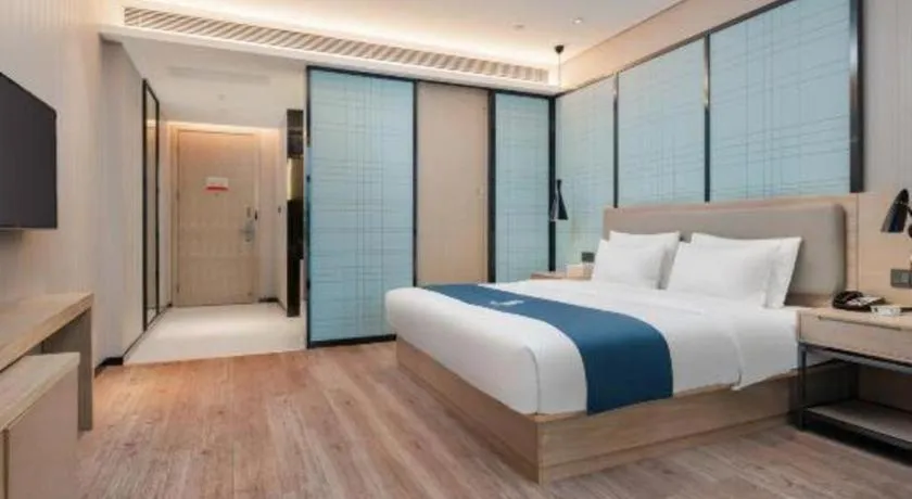 Bed in Echarm Hotel Liuzhou Liunan Wanda Plaza