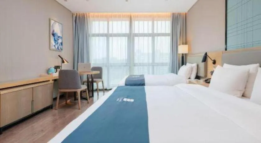 Bed in Echarm Hotel Liuzhou Liunan Wanda Plaza